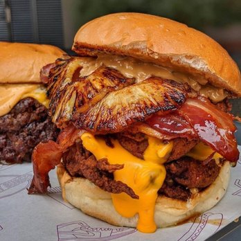 Saquic Taco - two burgers on a tray - Latin American Near Me - Dallas, Texas Saquic Taco - two burgers on a tray - Latin American Near Me - Dallas, Texas