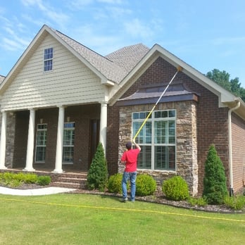 A Plus Pest Control - Sweeping the eaves to help rid your home of wasps, and spiders - Pest Control Near Me - Huntsville, Alabama