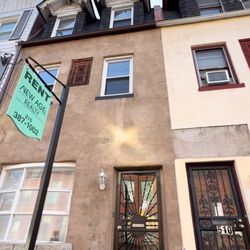New Age Realty Group - A wide-angle photo of a rental listing with our sign visible.