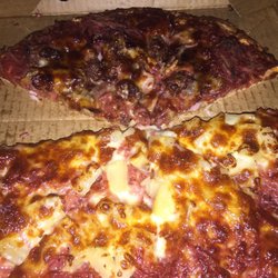 Cleeland Pizza House - Tropical (Hawaiian) with extra cheese in top and meat lovers.