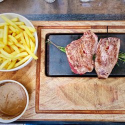 Les Platanes - Beef and Kangaroo steaks with a side of peppercorn sauce, cooked on a hot stone.