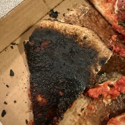 Back of the "bee sting" pizza. entire pizza was this burnt you couldn't even eat around it or scrape it off.
