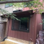 Photo of Roof.net - Fairfax, VA, United States. Fixed flashing on upper and lower roof with accompanying shingles.