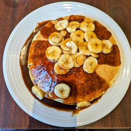 Cathedral pancakes with pecan syrup and bananas foster topping Cathedral pancakes with pecan syrup and bananas foster topping