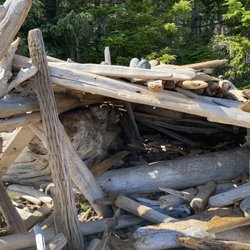 Rebecca Spit Marine Provincial Park - Driftwood huts on the beach