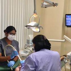 Yong & Kim Dental - Dr.Kim and Iris working on patient