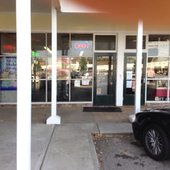 Wicker Basket - a car parked in front of a store - Delis Near Me - Mendham, New Jersey