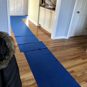 Blue Collar Moving - Rolling out the blue carpet to protect our floors. - Movers Near Me
