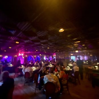 La Veranda Italian Restaurant - Restaurant dining area under black light. - Italian Near Me - Pompano Beach, Florida
