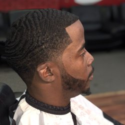 Hometown Barbershop - Wave cut with a low skin taper. Straight razor lineup with the use of color enhancement.