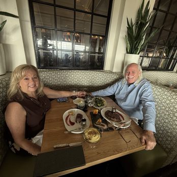 Orange Hill Restaurant & Events - We couldn't sit together because the table was built for a skinny teenager in the back. Trim 4" off the backside of the table. - Steakhouses Near Me - Orange, California Orange Hill Restaurant & Events - We couldn't sit together because the table was built for a skinny teenager in the back. Trim 4" off the backside of the table. - Steakhouses Near Me - Orange, California