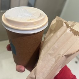 Latte and an almond croissant Latte and an almond croissant