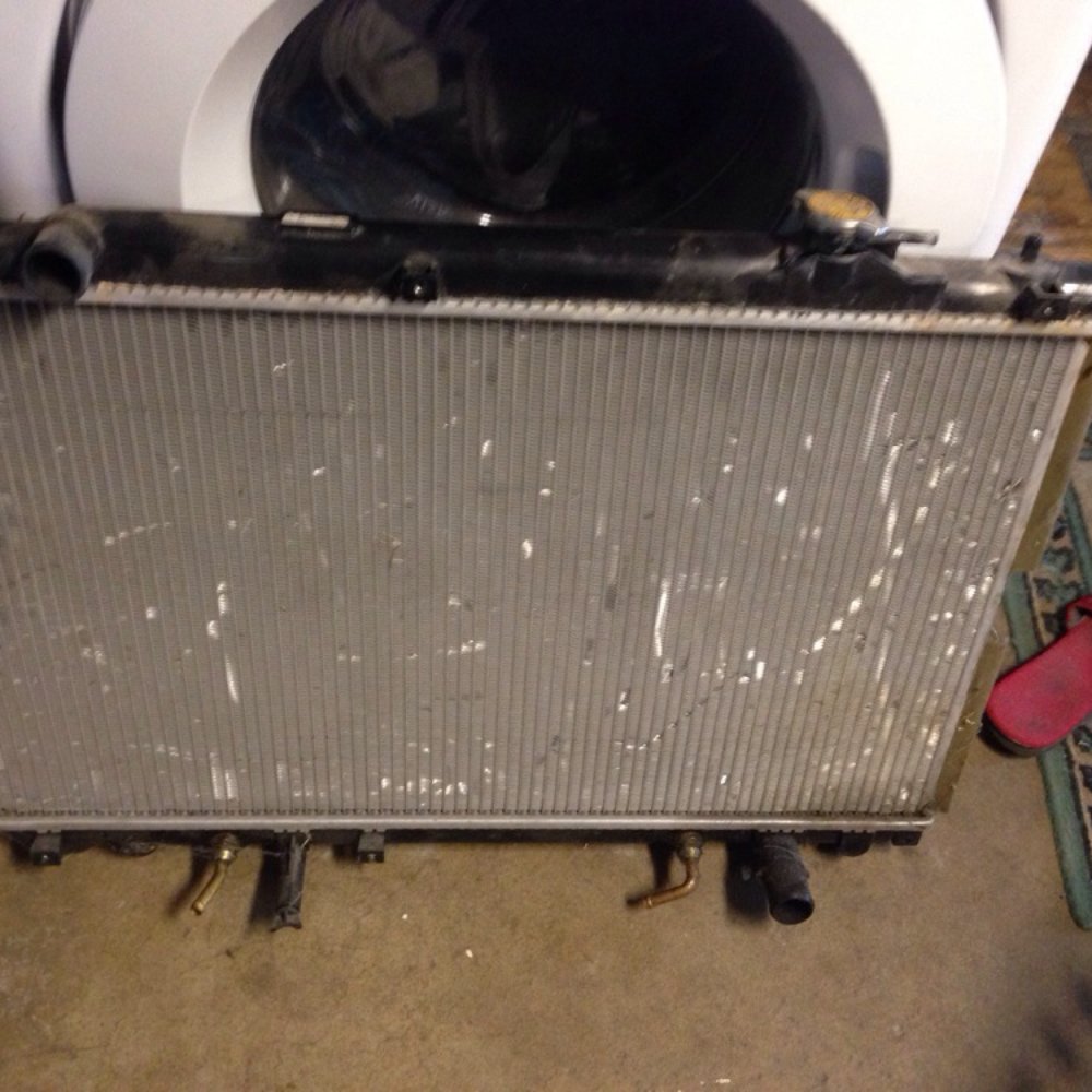 My radiator with the cracked plastic with the water leaked out and the missing brass pieces from the side My radiator with the cracked plastic with the water leaked out and the missing brass pieces from the side