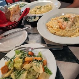 Caesar salad, chicken Alfredo, bread and ravioli Caesar salad, chicken Alfredo, bread and ravioli