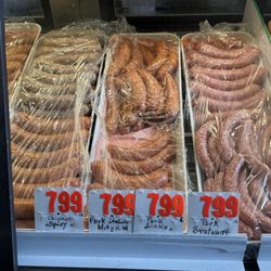 European Deluxe Sausage Kitchen - Here are photos of what's in the cases, which is more accurate than the old metal signs on the wall.