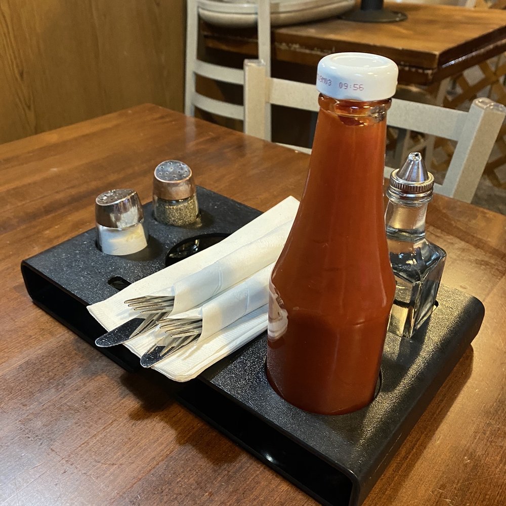 Burger Heaven - a bottle of ketchup on a tray - Burgers Near Me - New Westminster, British Columbia