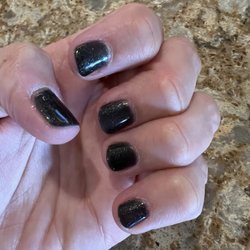 Galaxy Nail Spa - Green sparkly gel nails.
