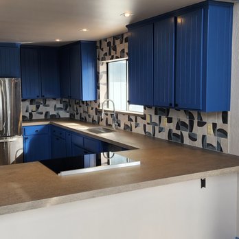 Shewmake Home Solutions - a kitchen with blue cabinets - General Contractors Near Me Shewmake Home Solutions - a kitchen with blue cabinets - General Contractors Near Me