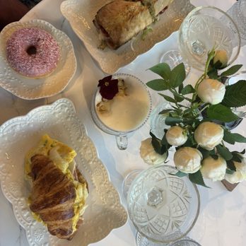 Glimmer Cafe - Egg, ham and cheese croissant and Italian sandwich to die for! Amaretto almond latte and a strawberry donut. 2 glasses of Prosecco! - Cafes Near Me - Delray Beach, Florida