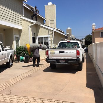 John Kowan Termite Control - Getting started.  Crew arrived on time with several vehicles. Job supervisor introduced himself and was the onsite point of contact. - Pest Control Near Me