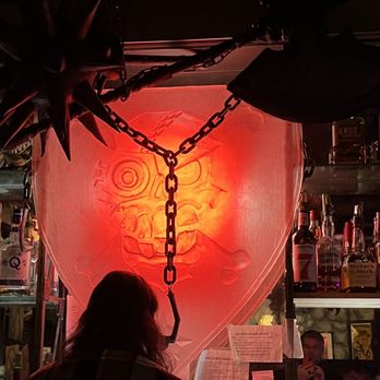 GWARbar - a man standing in front of a red heart - Barbeque Near Me - Richmond, Virginia