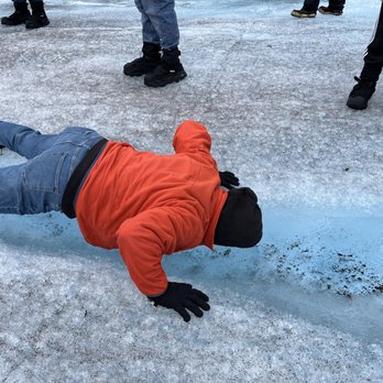 Temsco Helicopters - Drinking fresh from the glacier. While doing push ups - Tours Near Me - Juneau, Alaska