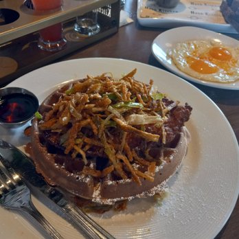 Hash Kitchen - Herb Fried Chicken & Waffle with a side of 2 eggs. DELICIOUS! Tip: Put the eggs on top, next pour maple syrup, then dig in. Perfection. - New American Near Me - Peoria, Arizona Hash Kitchen - Herb Fried Chicken & Waffle with a side of 2 eggs. DELICIOUS! Tip: Put the eggs on top, next pour maple syrup, then dig in. Perfection. - New American Near Me - Peoria, Arizona