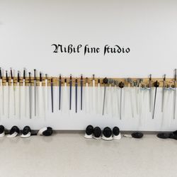 Swords on the wall at the Noble Science Academy.