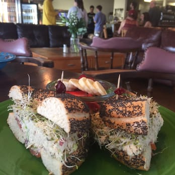 Delicomb - Tuna salad on a poppyseed bagel with a small side of fruit. - Coffee & Tea Near Me - Jacksonville Beach, Florida Delicomb - Tuna salad on a poppyseed bagel with a small side of fruit. - Coffee & Tea Near Me - Jacksonville Beach, Florida