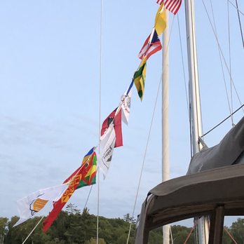 Superior Charters, Inc - Sailing flags at anchorage.  Note the quarantine flag (solid yellow).  We didn't have Covid - Boating Near Me - Bayfield, Wisconsin