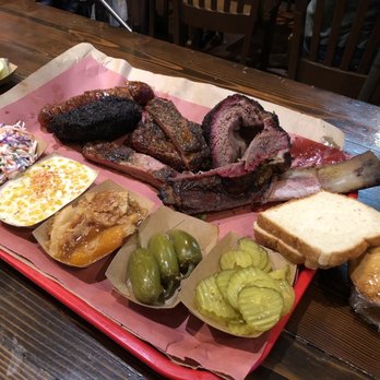 Terry Black's Barbecue - Sausage, brisket, pork ribs, beef ribs, cream corn, coleslaw, jalapenos, corn bread, peach cobbler, pickles, sliced bread, corn bread. - Barbeque Near Me - Austin, Texas