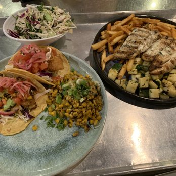 California Fish Grill - Crispy Fish and Cajun Swai Tacos with Roasted Corn and Kaleslaw (L) and Maple Glaze Branzino with Fries and Rosemary Zucchini (R) - Seafood Near Me - Irvine, California California Fish Grill - Crispy Fish and Cajun Swai Tacos with Roasted Corn and Kaleslaw (L) and Maple Glaze Branzino with Fries and Rosemary Zucchini (R) - Seafood Near Me - Irvine, California