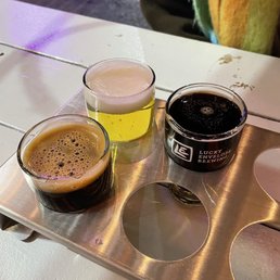 Top left: white rabbit yuzu pilsner Top right: white rabbit milk stout Bottom: double happiness chai stout