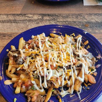 El Trompo Mexican Grill Colerain - Asada Fries appetizer and Chimichangas - Mexican Near Me - Cincinnati, Ohio El Trompo Mexican Grill Colerain - Asada Fries appetizer and Chimichangas - Mexican Near Me - Cincinnati, Ohio