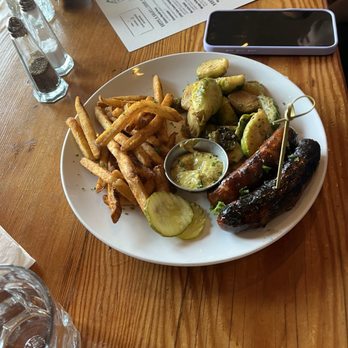 Wirtshaus - Original Sausage Platter with Brussels sprouts and French fries - German Near Me - Los Angeles, California Wirtshaus - Original Sausage Platter with Brussels sprouts and French fries - German Near Me - Los Angeles, California