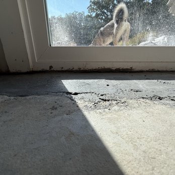 Acculevel - That's my new sliding door with concrete all over it and a gap between that and the concrete now - Waterproofing Near Me - Belleville, Illinois