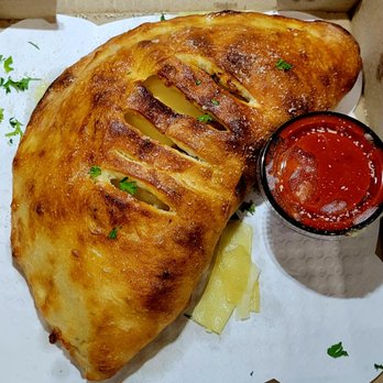 Bronx House Pizza - The calzone looked as perfect as the large 2 topping pizza.  The picture can't capture how nice it looked. - Pizza Near Me - Saint Johns, Florida