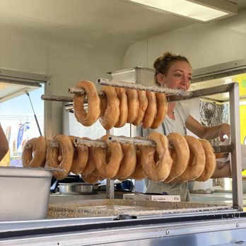 Peachey's Baking - a woman preparing doughnuts - Food Trucks Near Me - Sarasota, Florida Peachey's Baking - a woman preparing doughnuts - Food Trucks Near Me - Sarasota, Florida