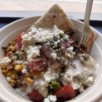 CAVA - White rice, lentils, chicken, feta cheese, broccoli, tomatoes & onions, corn. Greek vinaigrette dressing. - Mediterranean Near Me - Framingham, Massachusetts