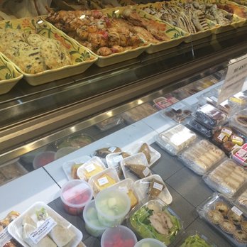 Eatz Encore - a variety of food items in a display case - Bakeries Near Me - Westmount, Quebec