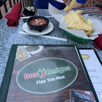 Dos Amigos - a man eating a tortilla at a restaurant - Tex-Mex Near Me - Alexandria, Virginia