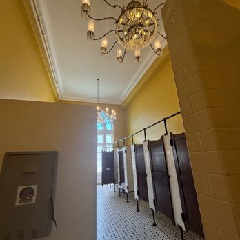 Nic & Norman's - Women's bathroom chandeliers - American Near Me - Chattanooga, Tennessee