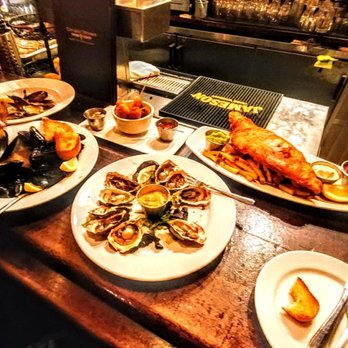 The Auld Dubliner - Mussells, oysters, bread and the  absolutely delicious non scrimpy sized FISH n Chips ! - Irish Near Me - Long Beach, California