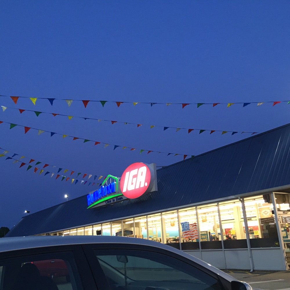 IGA - a car parked in front of a store - Grocery Near Me - Owensboro, Kentucky