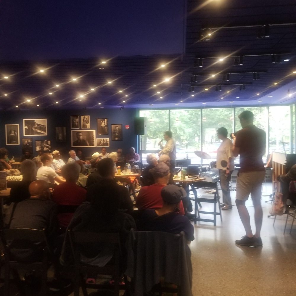 Café Logan - a large group of people sitting at tables - Cafes Near Me - Chicago, Illinois Café Logan - a large group of people sitting at tables - Cafes Near Me - Chicago, Illinois