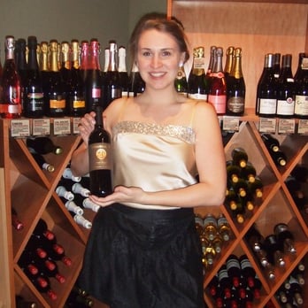 Marczyk Fine Wines - a woman holding a bottle of wine - Beer, Wine & Spirits Near Me - Denver, Colorado Marczyk Fine Wines - a woman holding a bottle of wine - Beer, Wine & Spirits Near Me - Denver, Colorado
