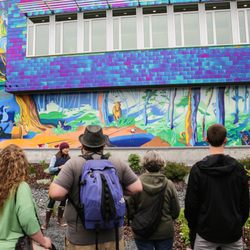The Painted Whale - Visitors learn about 'The Irresistible Story' mural at the library.