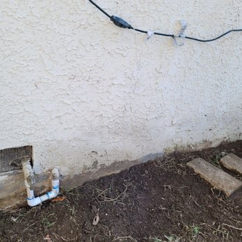 Courtesy Plumbing - The "after" photo from a slight distance. Old pipes removed, PVC piping installed in shortened section. - Plumbing Near Me - Covina, California Courtesy Plumbing - The "after" photo from a slight distance. Old pipes removed, PVC piping installed in shortened section. - Plumbing Near Me - Covina, California