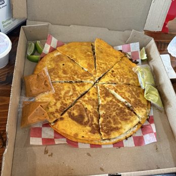 The Taco Shop - Birria Pizza- flour tortilla(1 on top and 1 on bottom), shredded beef, cheese, consomé - Mexican Near Me - Franklin, Tennessee