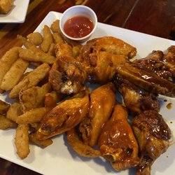 Our Spot - Buffalo and Cajun Jerk chicken Wings (12) with side